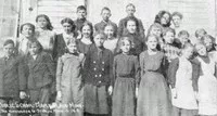 group of teen boys and girls outside their school