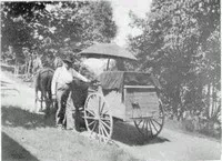 man next to his horse and cart he used to deliver cream and butter