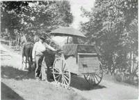 man next to his horse and cart he used to deliver cream and butter