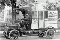 old automobile with cart attached