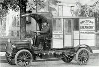old automobile with cart attached
