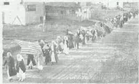 Line of people marching in Armistice Day Parade
