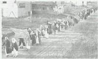 Line of people marching in Armistice Day Parade