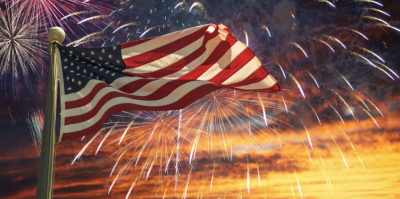 American Flag with fireworks in the background